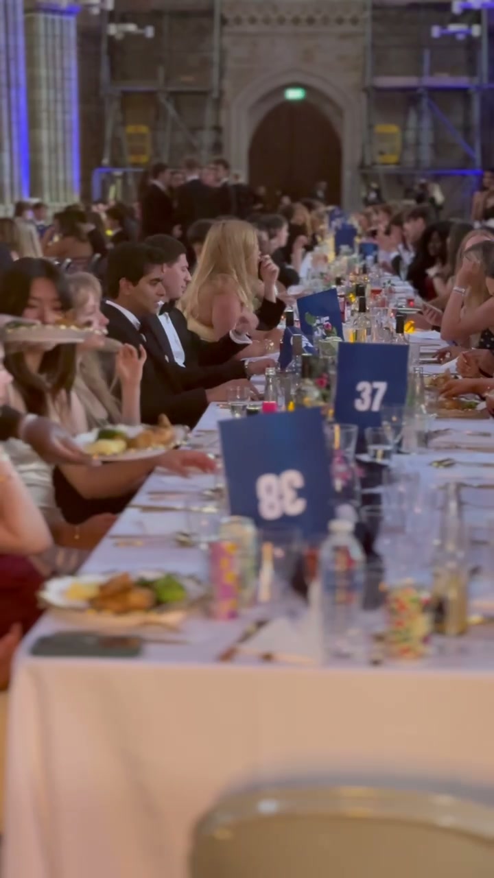 Glasses set on the tables at a catered celebration